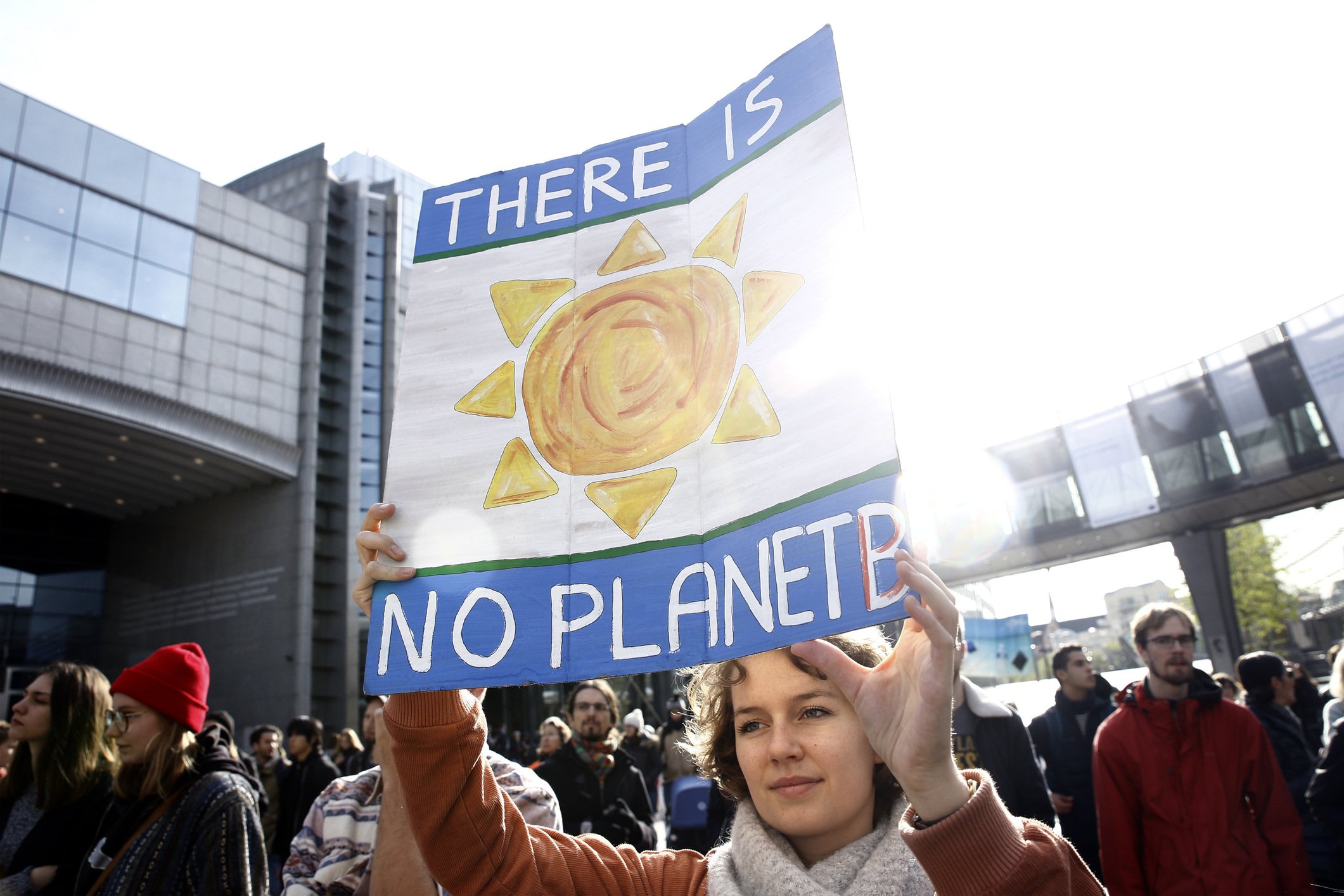 Woman protesting with a sign stating that there is no planet B.