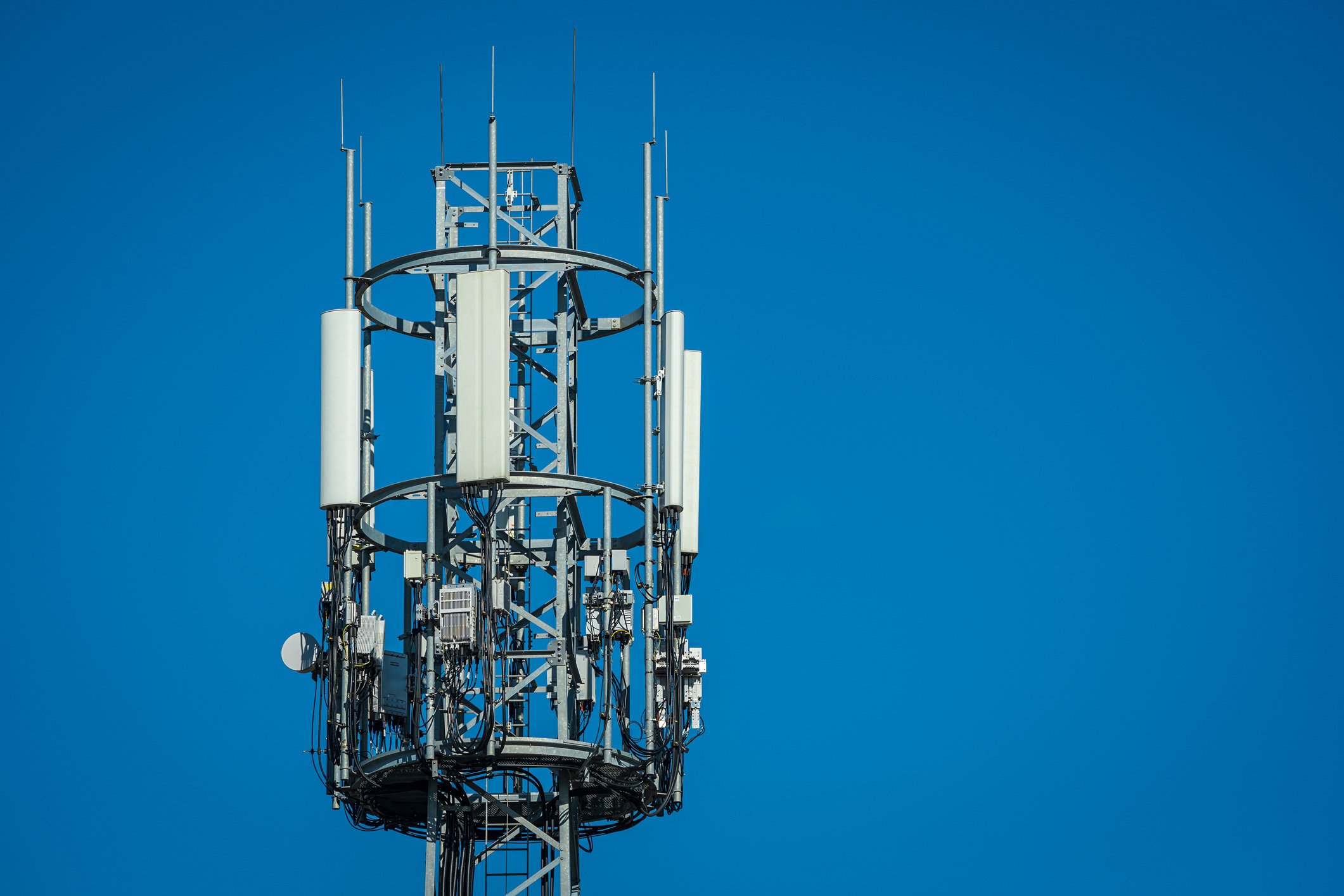 5G telecommunication tower on a sunny day.