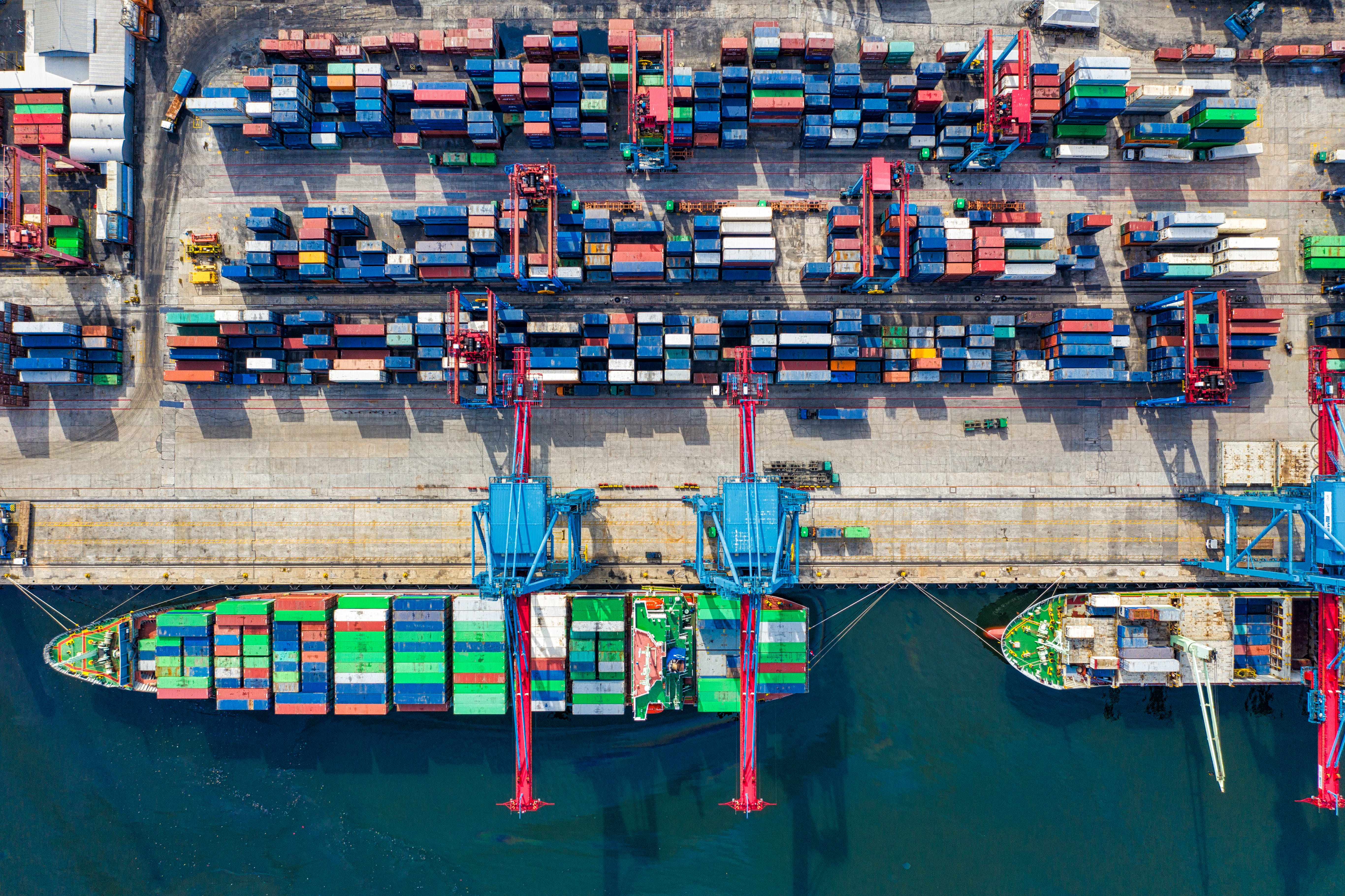 Shipping containers being loaded onto a large container ship.